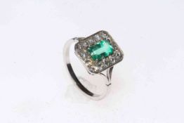 Emerald and diamond platinum ring, the rectangular setting with approximately 0.