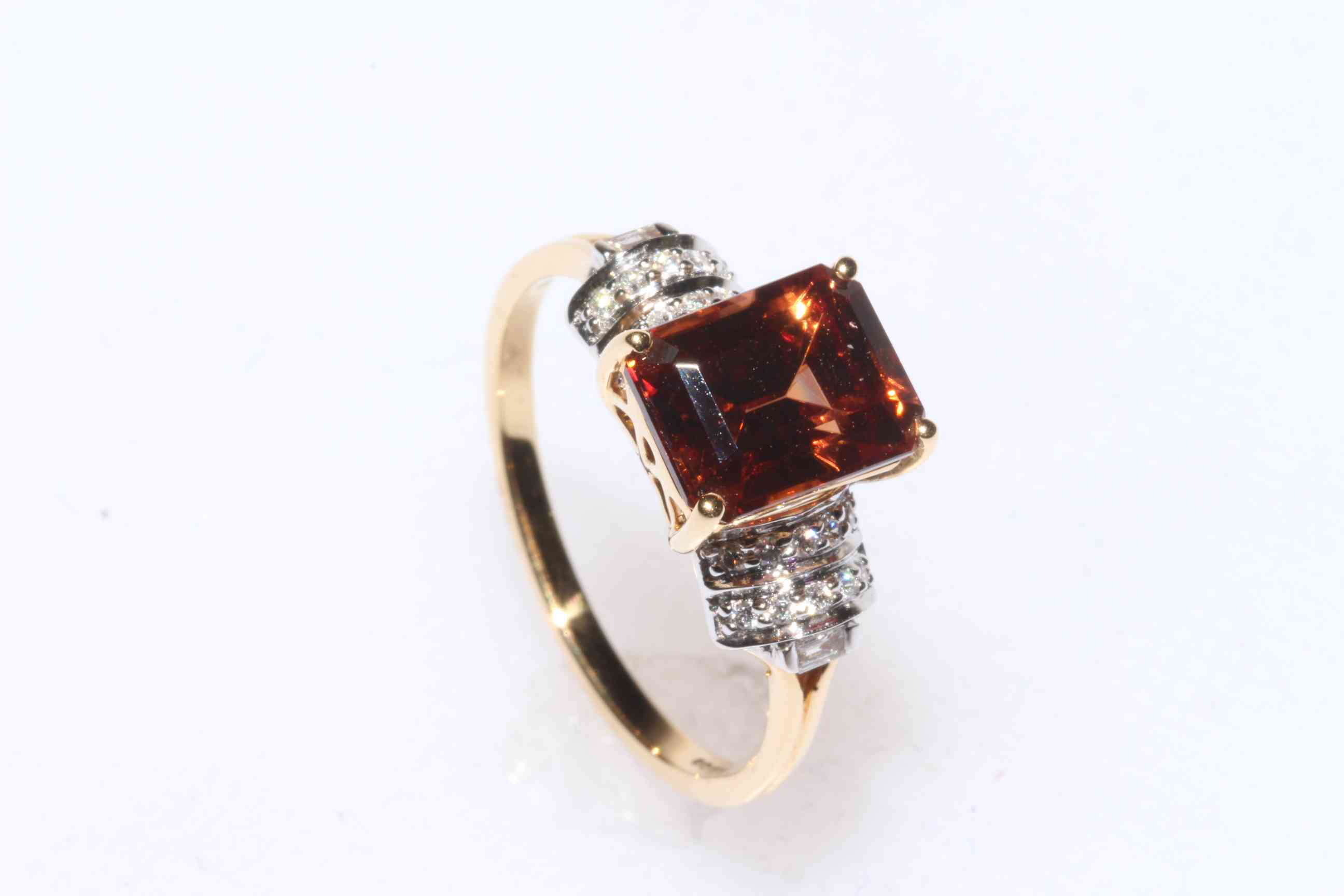 Zanzibar Sunburst Zircon and diamond ring set in 18 carat yellow gold, size N/O, with certificate.