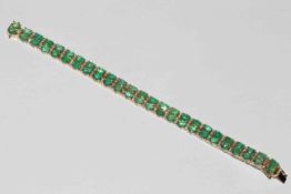 Emerald and diamond 14 carat gold bracelet set with 25 pairs (50) of oval cut emeralds,