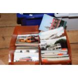 Two boxes housing albums and loose photographs, reproduction photos and printed postcards of buses,