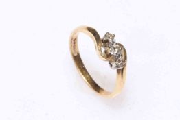 18 carat gold and three stone diamond ring, size M.