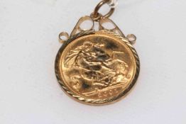 2001 half sovereign in 9 carat gold pendant mount.