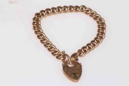 9 carat gold chain link bracelet with padlock fastener.