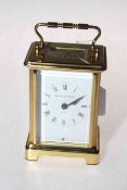 French gilt brass carriage clock, dial signed Watches of Switzerland, 14cm including handle.