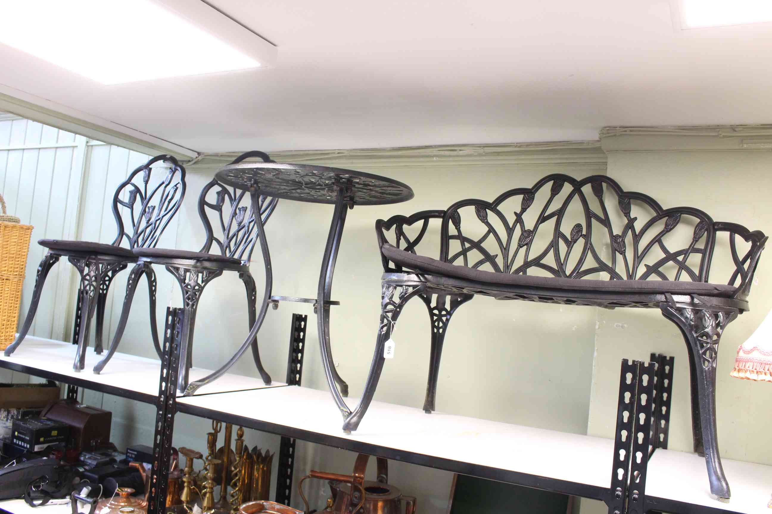 Black painted aluminium four piece patio set comprising circular table,