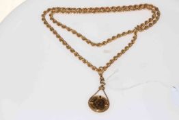 1982 gold half sovereign in 9 carat gold pendant mount, and hung from rope twist necklace.