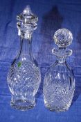 Two Waterford crystal decanters and stoppers.