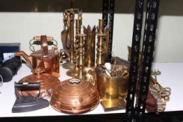 A good collection of brass and copper wares including two large pouring vessels, copper kettle,