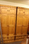 Pair pine two door combination wardrobes and top boxes, 236cm high by 103cm wide by 55cm deep.