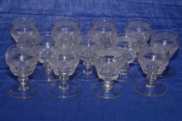 Set of twelve Georgian sherry goblets with hobnail and faceted bowls.