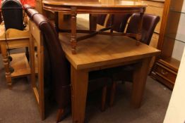 Pine rectangular dining table and eight faux leather chairs.