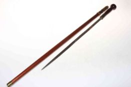 Mahogany sword stick with woven hilt, 87cm long.