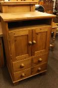 Pine two drawer low centre table and pine two door, four drawer entertainment unit.