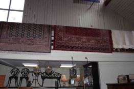 Blue ground Bokhara style rug 2.15 by 1.58, red ground Bokhara style carpet 2.75 by 2.