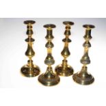 Two pairs of Victorian brass candlesticks and copper kettle.