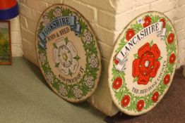 Two circular signs, Yorkshire and Lancashire.