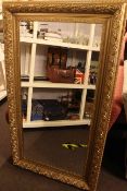 Rectangular gilt framed bevelled wall mirror, 148cm by 85cm overall.