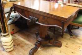 Victorian mahogany fold top tea table on octagonal pedestal triform base,