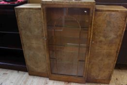 1930's walnut cabinet bookcase having central glazed panel door flanked by two cupboard doors,