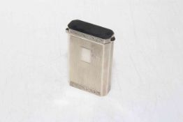 Silver engine-turned snap top cigarette case with hinged floor, Birmingham 1959, 7.5cm by 5cm.
