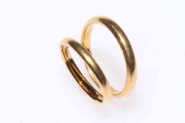 Two 22 carat gold band rings.