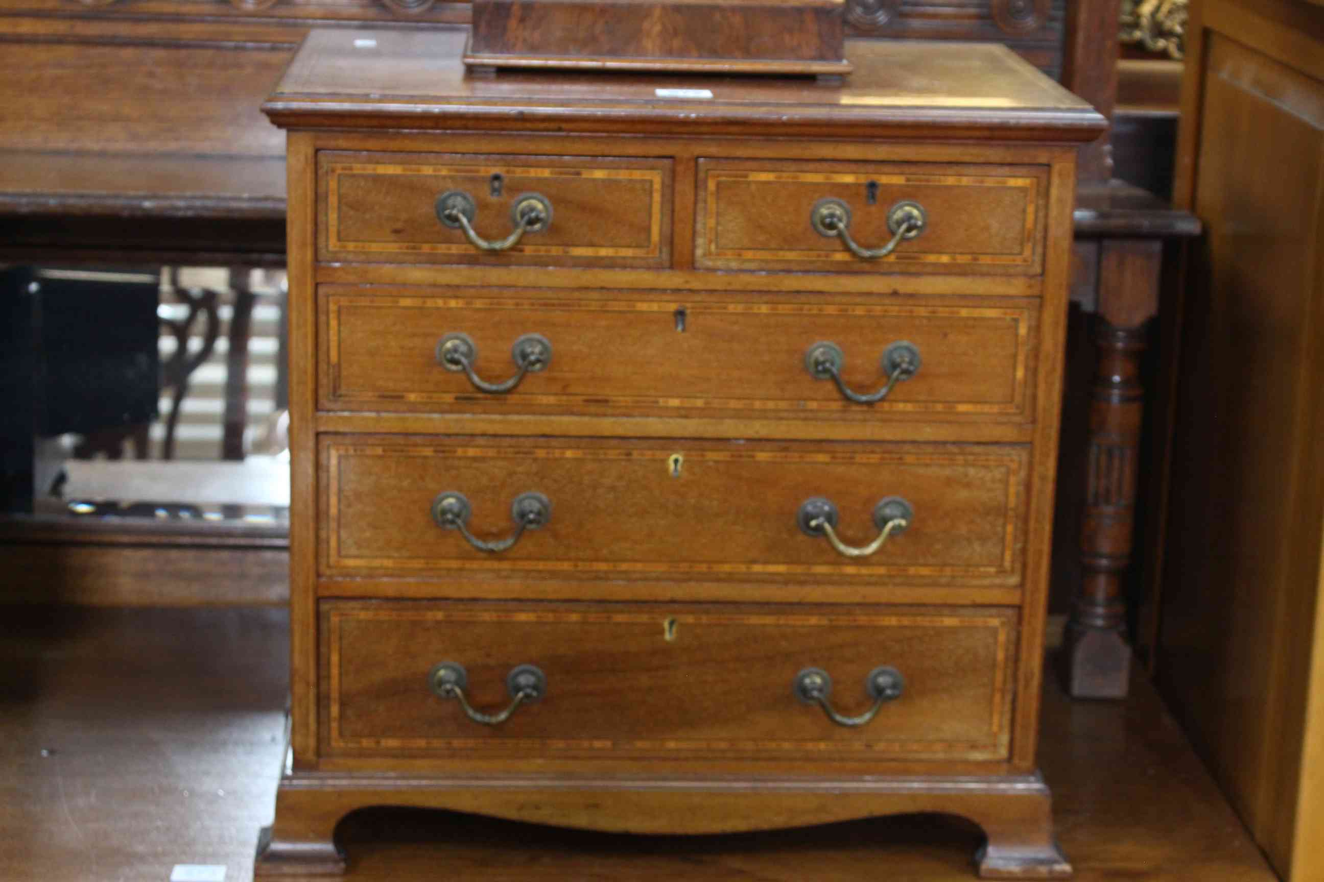Late 19th Century mahogany and line inlaid miniature chest of two short above three long drawers on