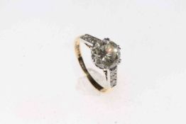 Two carat plus solitaire diamond ring with brilliant shoulders set in 18 carat gold and platinum,