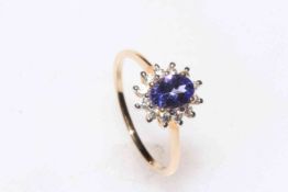 Tanzanite and zircon 9 carat gold cluster ring, size P/Q, with certificate.