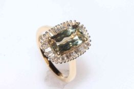 Diaspore (3.75ct) and diamond cluster ring set in 18 carat yellow gold, size N, with certificate.