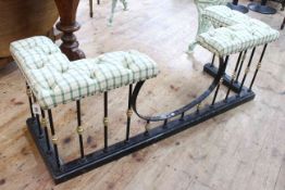 Iron, brass and buttoned tartan fabric club fender, 50cm high by 134cm wide by 46cm deep.