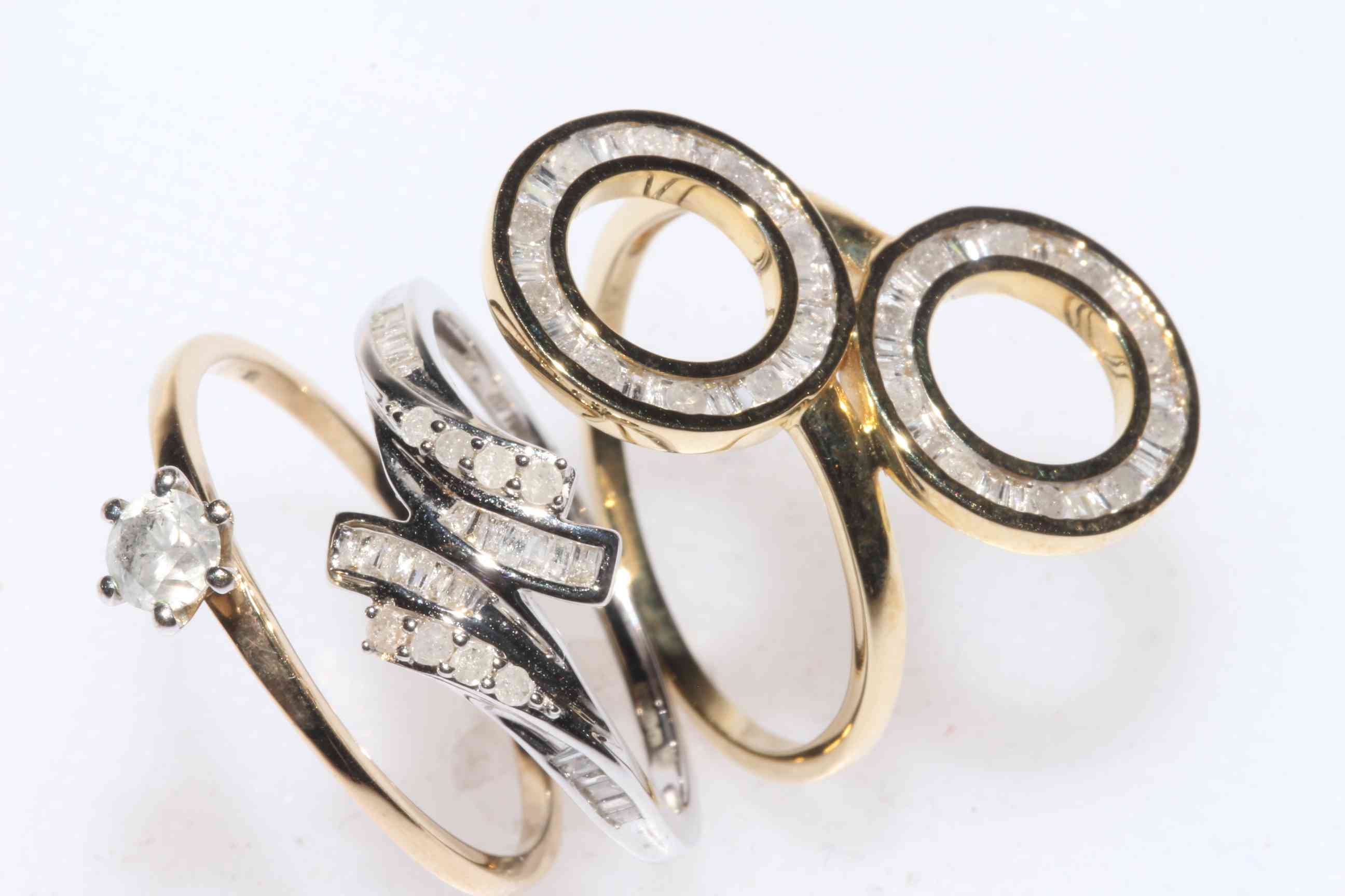 Two 9 carat gold and one 10k gold and diamond set rings, sizes Q-S (3).