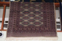 Green ground Bokhara style rug 2.20 by 1.22.