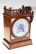 Walnut and enamelled mantel clock with painted and enamelled dial, 34cm high.