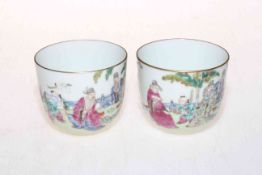 Pair of Chinese polychrome tea bowls with figure decoration.