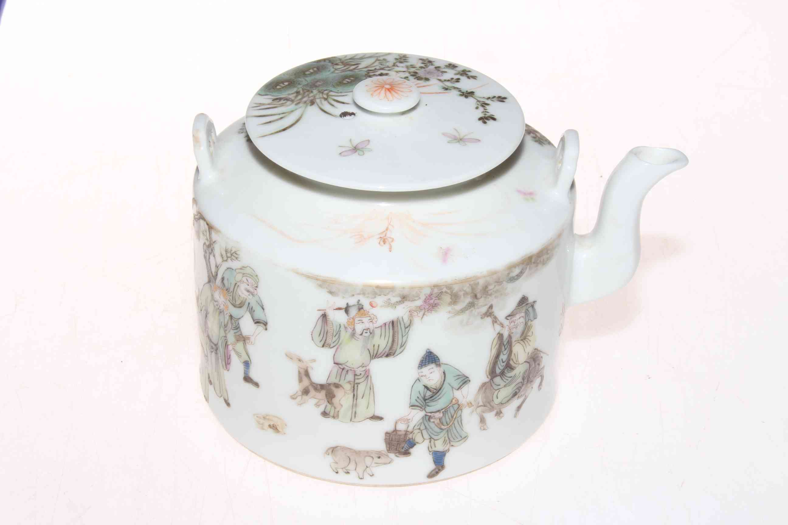 Chinese teapot with figure decoration.