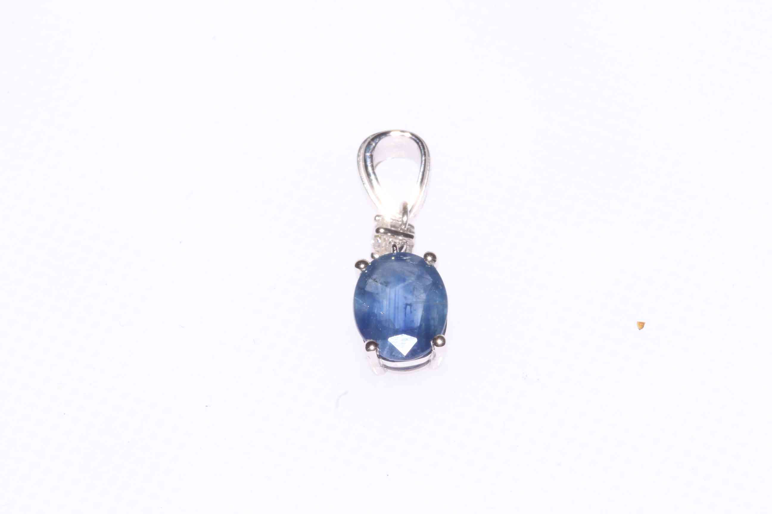 14 carat white gold, 1.3 carat sapphire and diamond pendant, with certificate.
