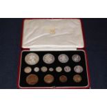 A good George V 1937 specimen coin set within a burgundy red gilt presentation leather case.