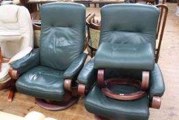 Pair Himola green leather reclining swivel chairs and one footstool.