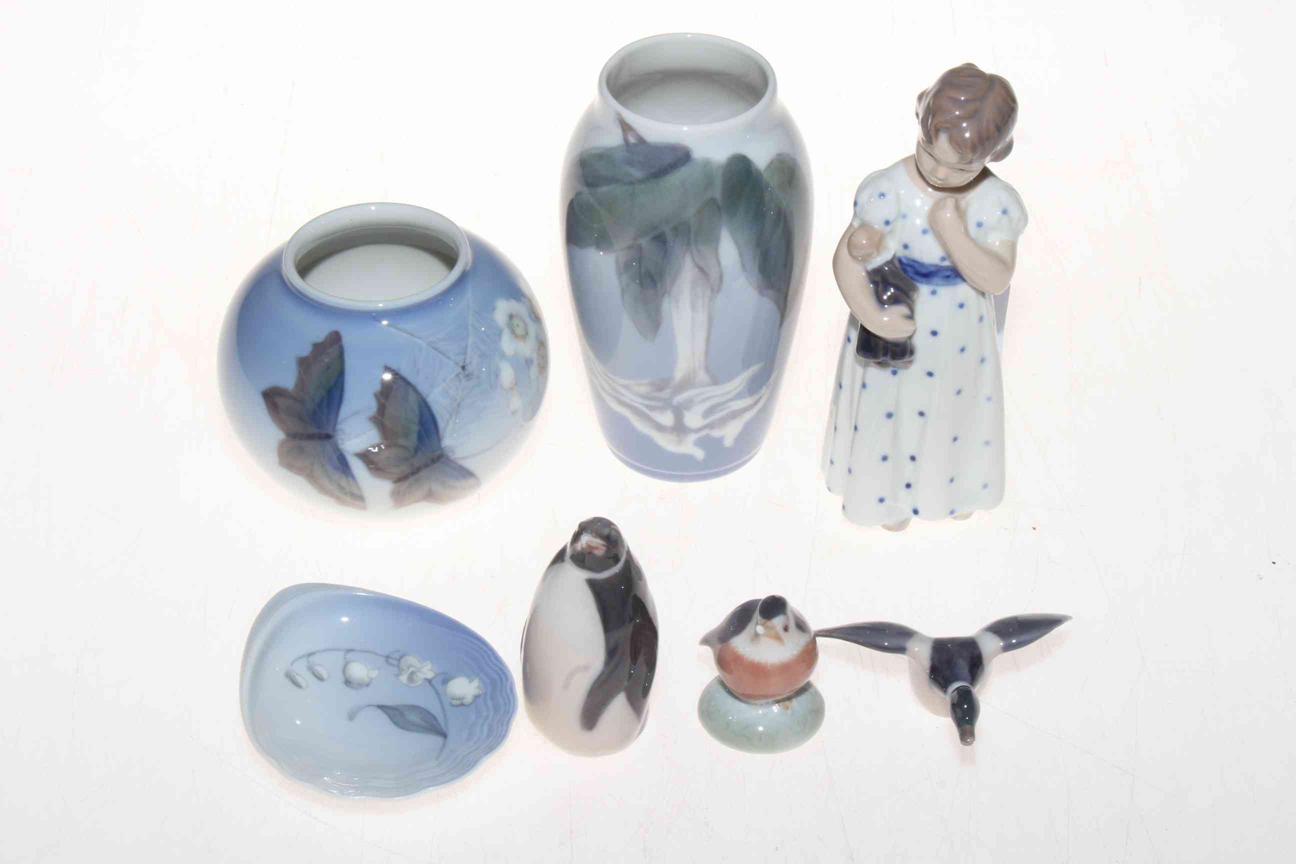 Collection of seven pieces of Royal Copenhagen including child figure, Penguin, vases, etc.
