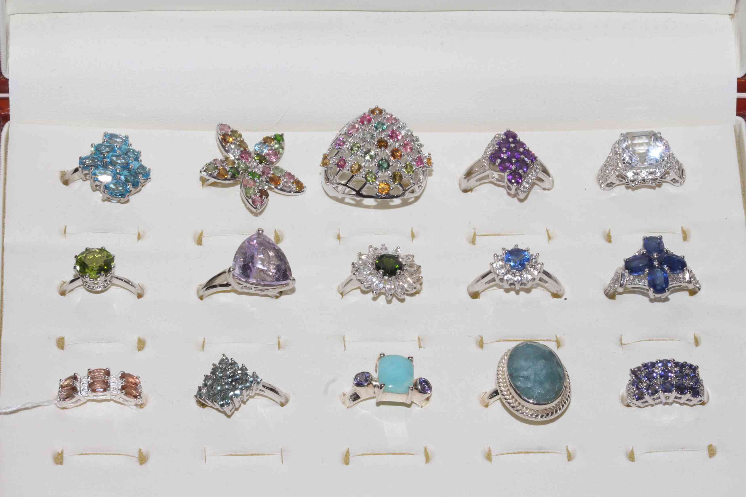 Collection of fifteen silver gem set rings, most with certificates.
