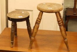 Two Antique ash and elm milking stools.