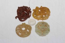 Four Chinese carved jade pieces and toggle (5).