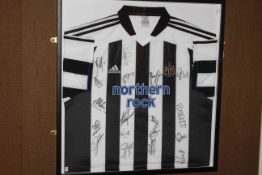 Framed autographed Newcastle FC 2004/2005 shirt including Alan Shearer etc with accompanying framed