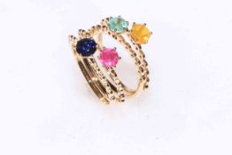 Four matching 9k gold rings set with sapphire, ruby, emerald and opal.