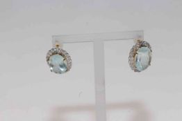 14 carat yellow gold, 11 carat aquamarine and diamond earrings, with certificate.