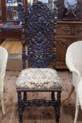 Heavily carved Jacobean style side chair.