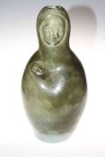 Green pottery vase in the form of a mother with child, with impressed mark to base 'Adamsez'.