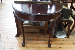 Mahogany Chippendale style demi lune fold top card table on ball and claw feet,