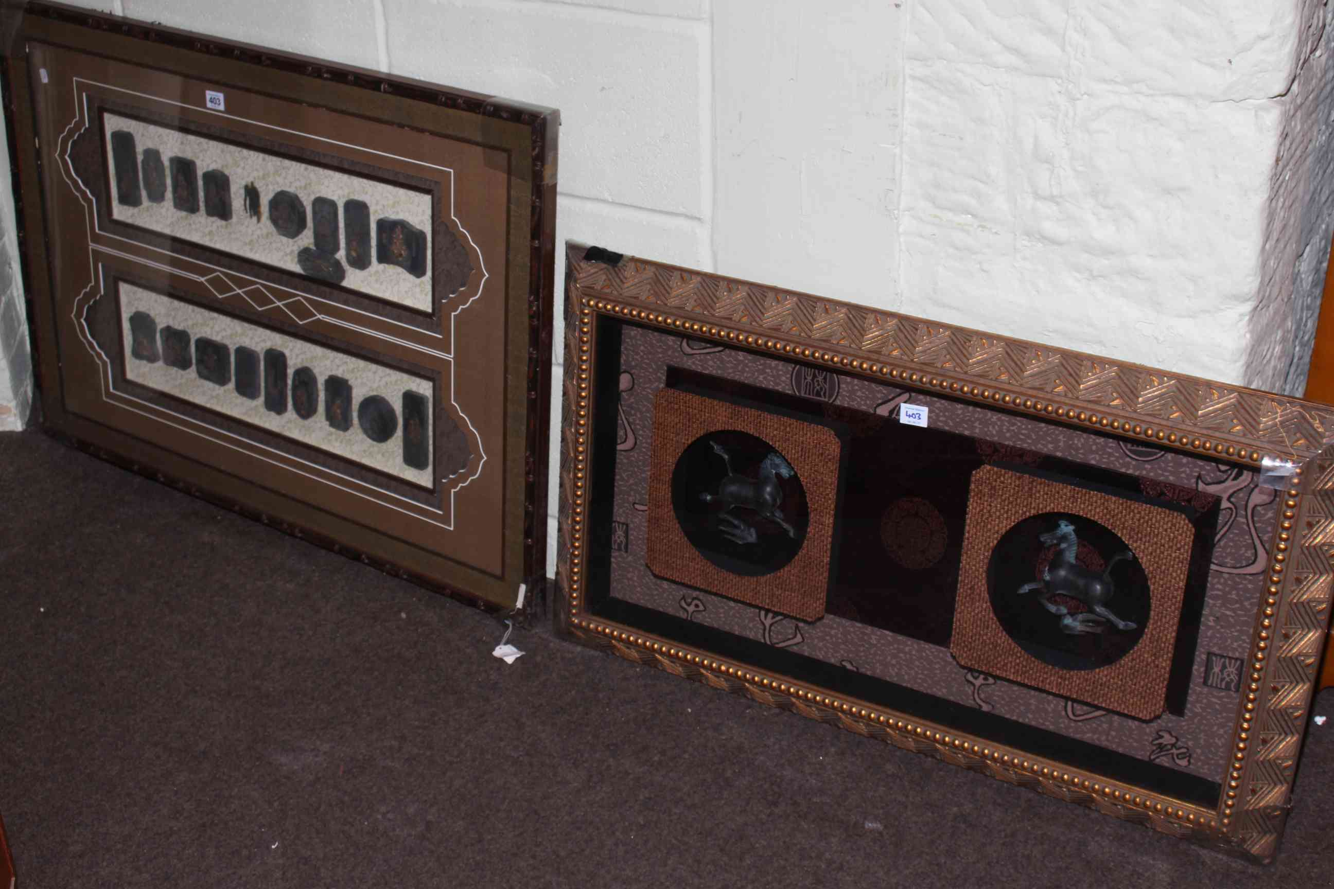 Two reproduction Oriental framed displays of bronzed horses and ink blocks.