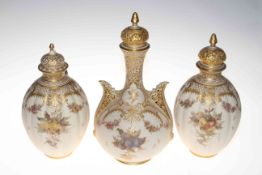 Three Royal Crown Derby blush and gilt vases, being a pair with lobed bodies 28cm,